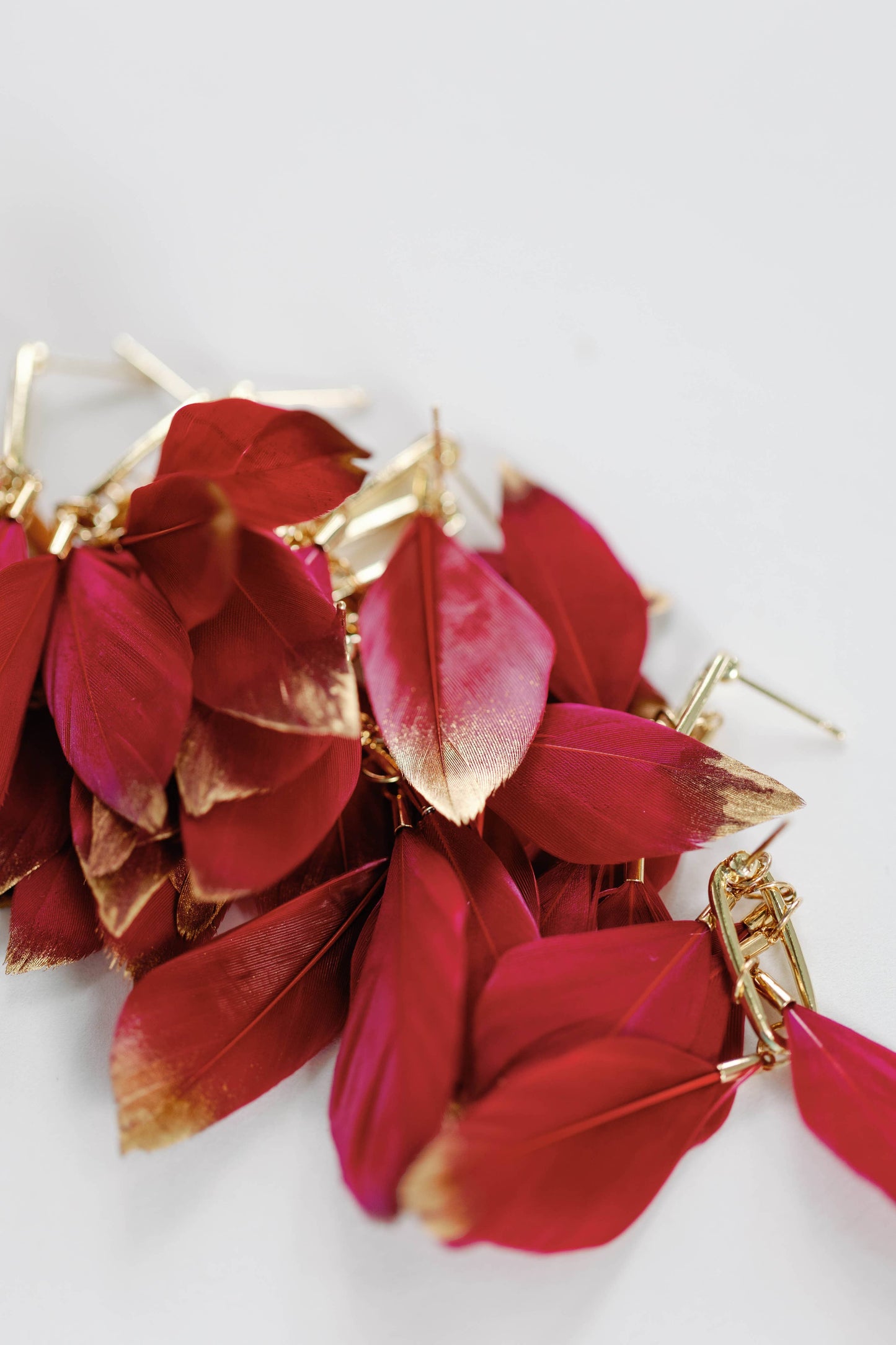 Garnet Gold Dipped Feather Statement Earrings