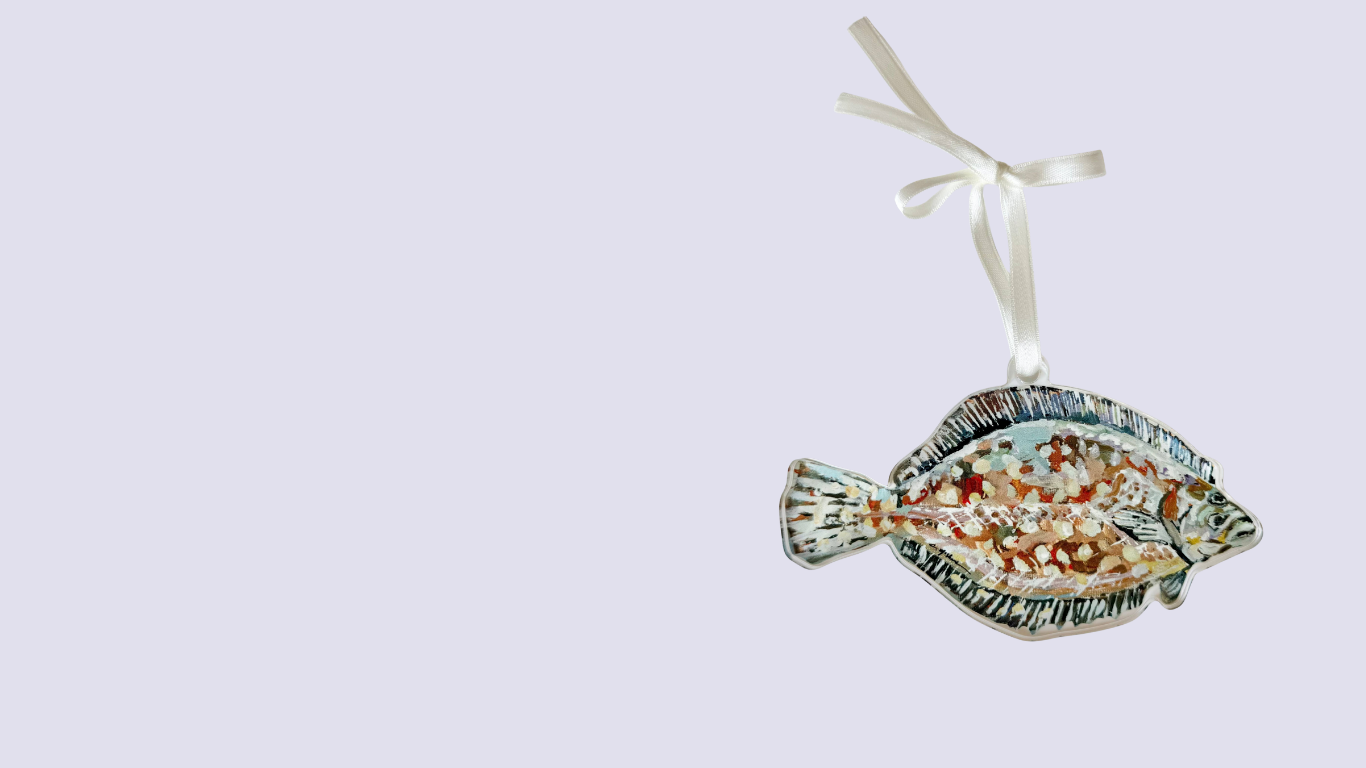Decorative fish ornament with a ribbon on a light gray background