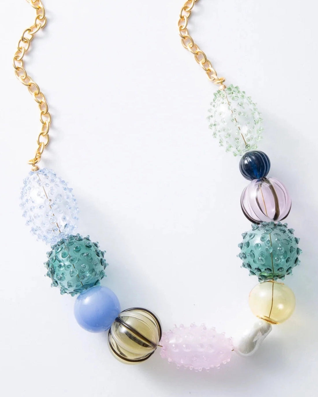 Necklace with colorful beads on a white background